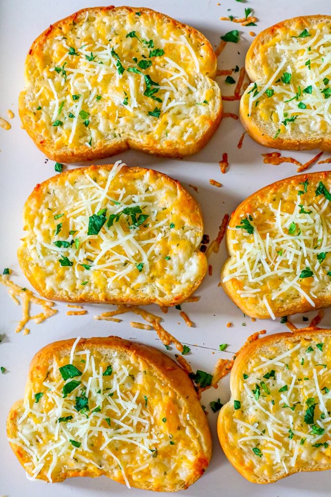 picture of six slices of toast with cheese on top 