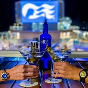Two people on the Ultimate Sky Princess Cruise Ship Bar Crawl, enjoying martinis at bars on the Sky Princess.