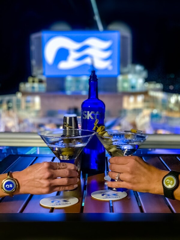 Two people on the Ultimate Sky Princess Cruise Ship Bar Crawl, enjoying martinis at bars on the Sky Princess.
