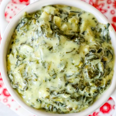 Spinach dip recipe in a white bowl.