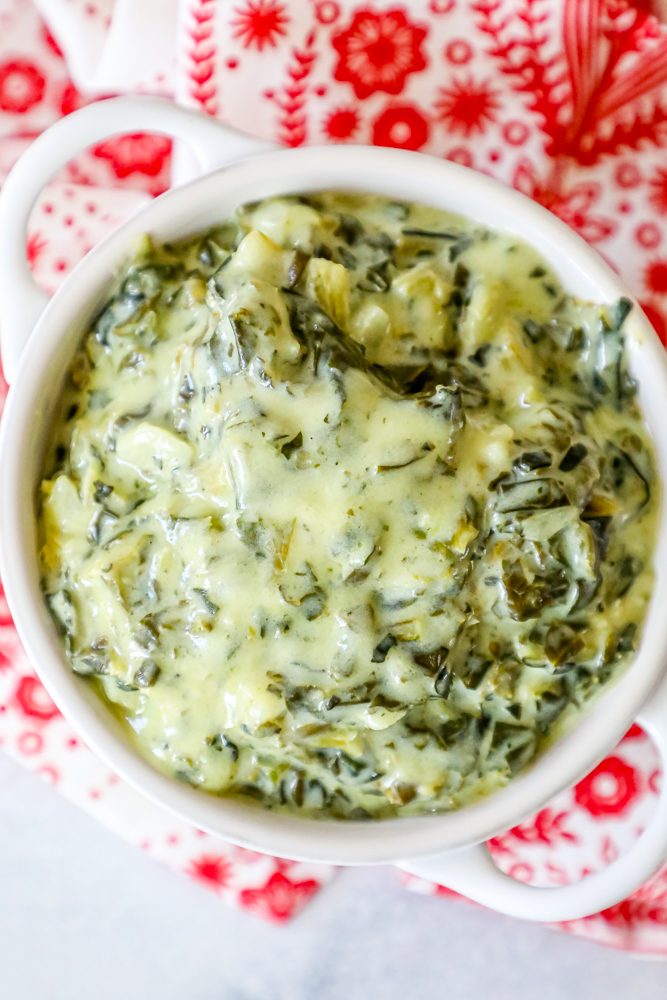 creamed green spinach in a white bowl