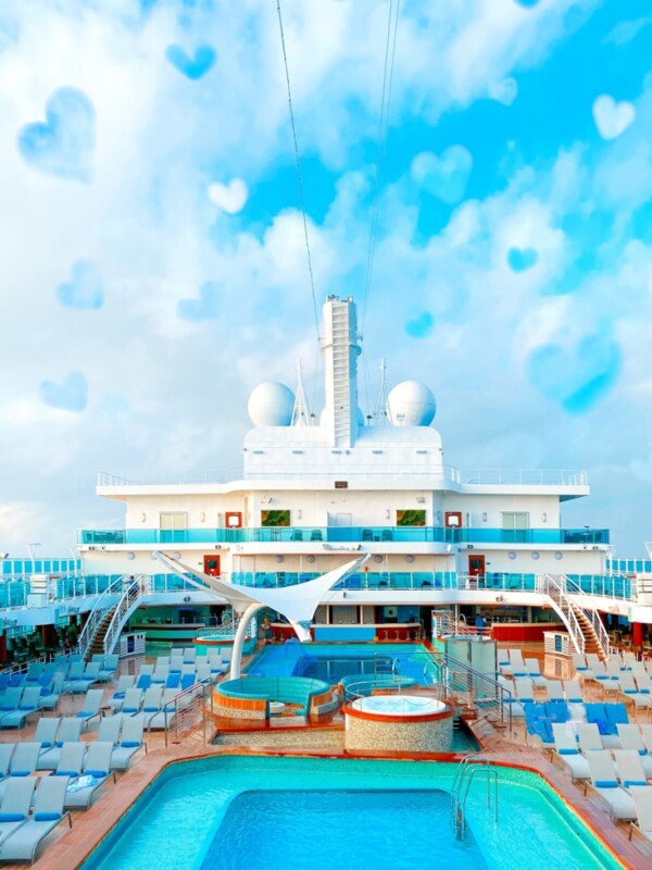 A romantic Cruise aboard the Sky Princess with a pool and lounge chairs.
