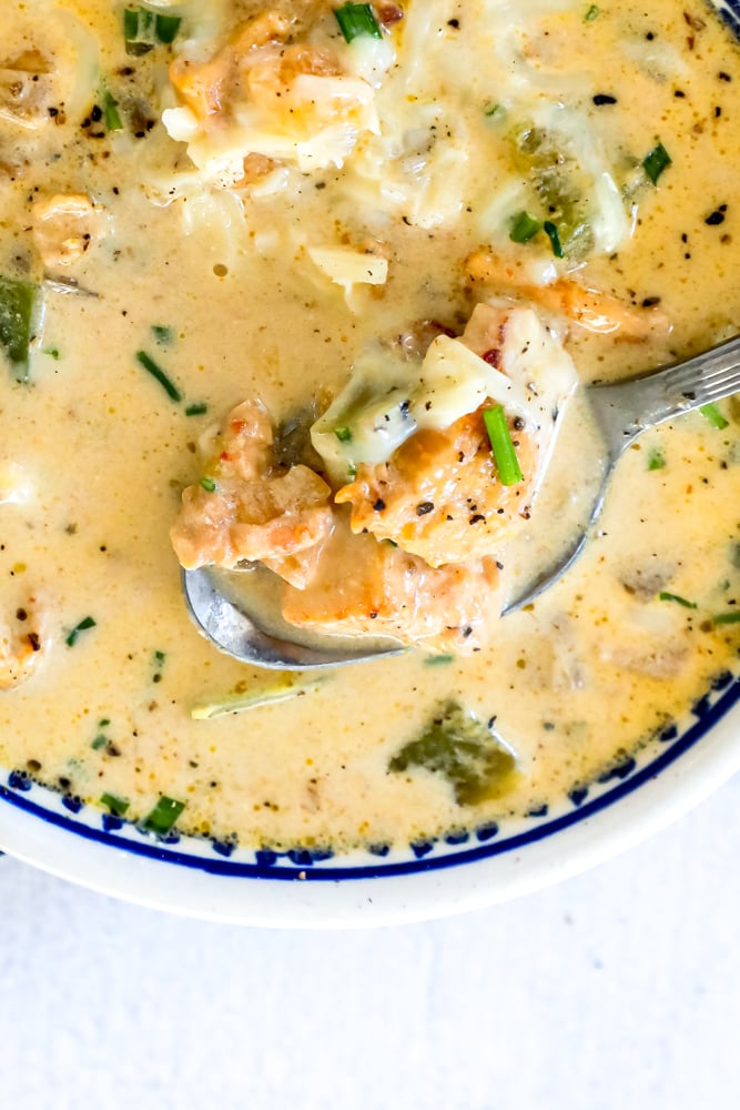 white chicken chili in a bowl with a spoon