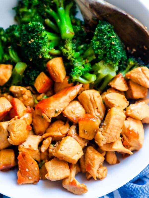 Instant Pot Chicken Teriyaki Recipe in a white bowl with a wooden spoon.