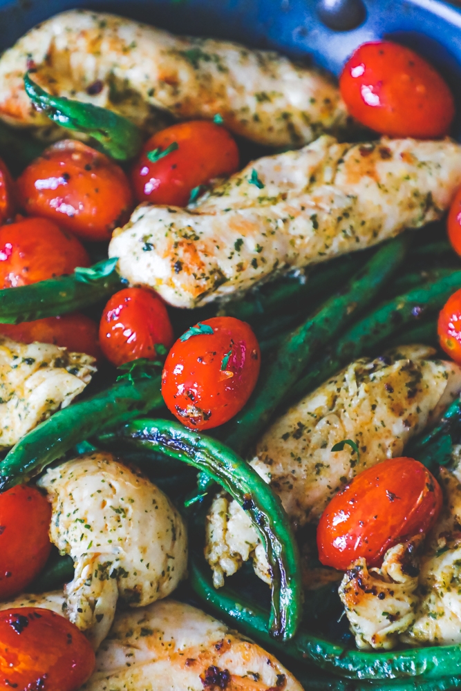 chicken, green beans, and tomatoes in a pan