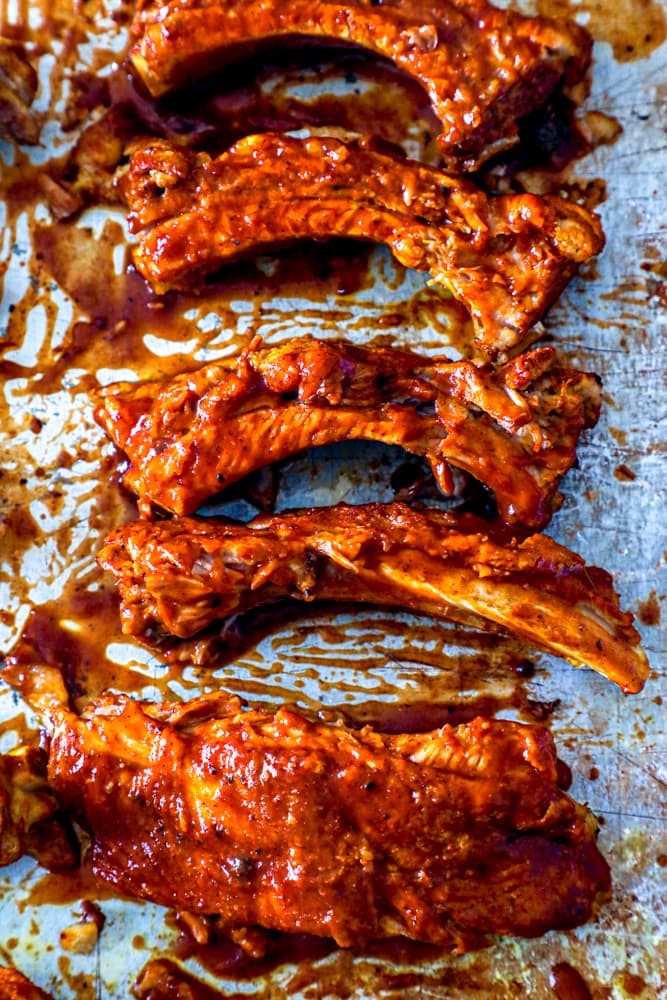 picture of ribs with bbq sauce on baking sheet