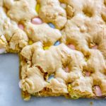 Easter Candy Recipes: Easy Blondies Recipe featuring Cadbury Mini Eggs, baked on a sheet.