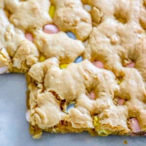 Easter Candy Recipes: Easy Blondies Recipe featuring Cadbury Mini Eggs, baked on a sheet.