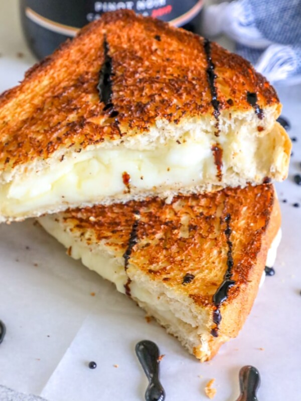 A grilled cheese sandwich enhanced with a wine sauce.