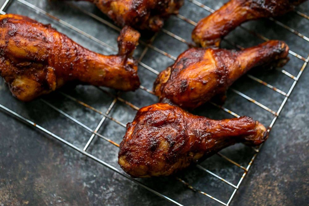 Picture of baked bbq chicken legs on wire rack