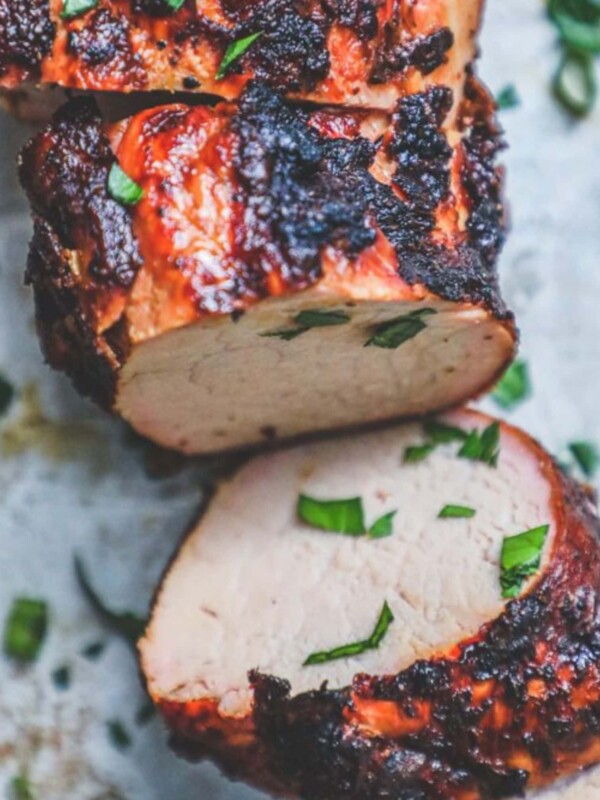 picture of grilled pork tenderloin on a baking sheet