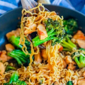 Chicken and broccoli stir fry with teriyaki sauce in a skillet.