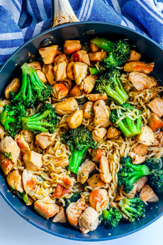 noodles with chicken and broccoli in a skillet