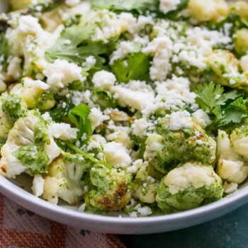 cauliflower in cashew pesto in a white bowl