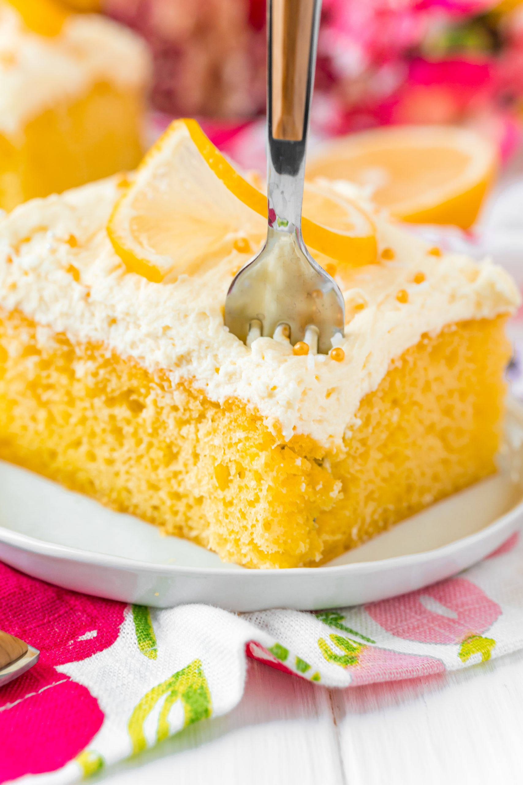 A slice of Jello Poke Cake on a plate.