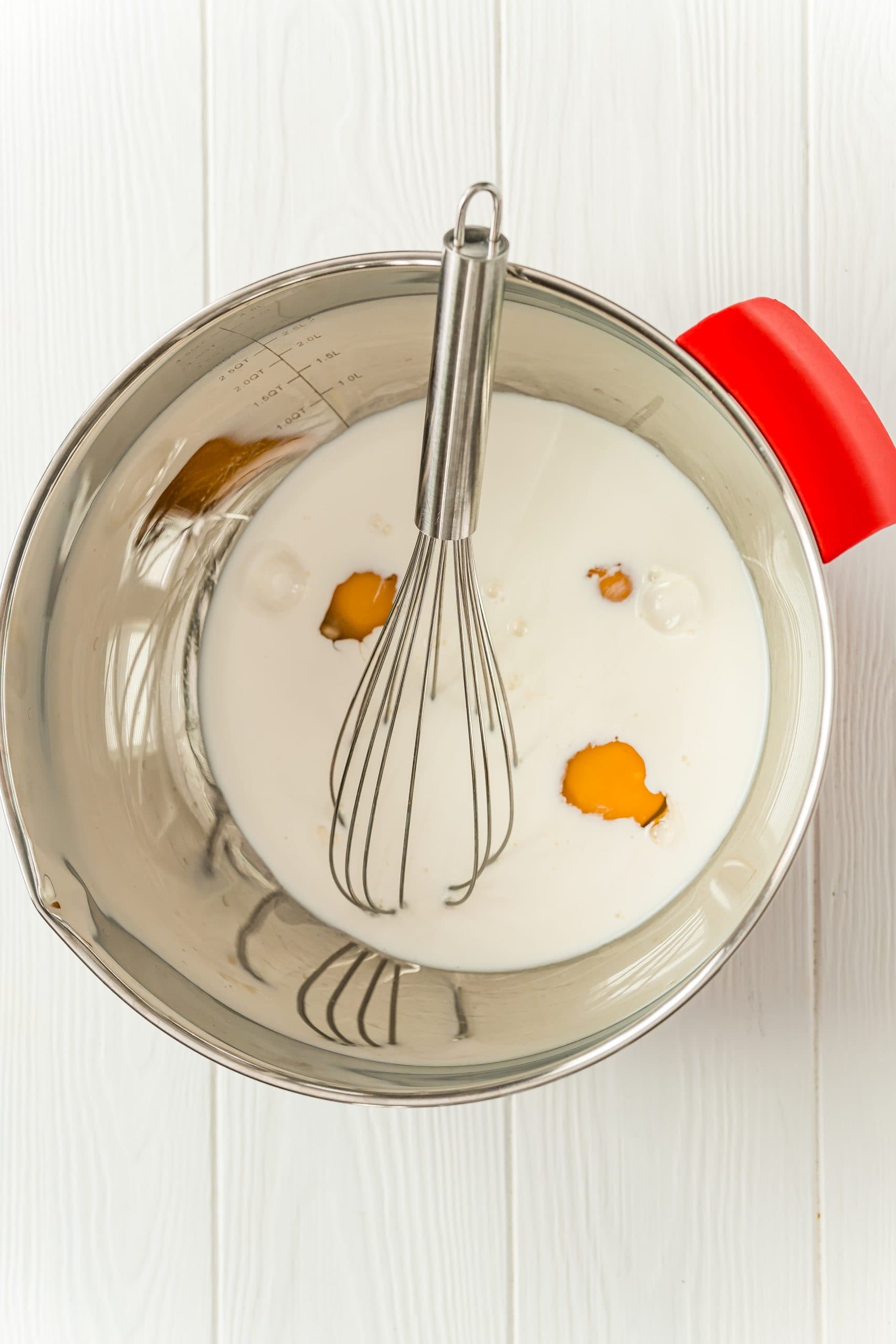 bowl with milk, eggs in it