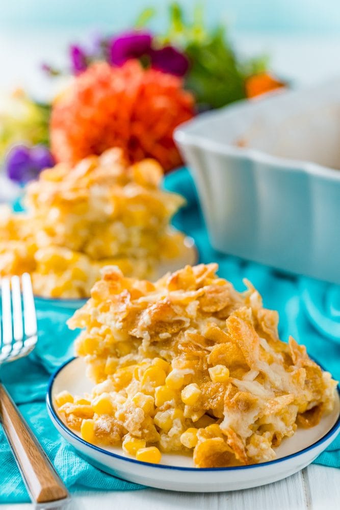baked scalloped corn with crunchy cornflakes on a white plate