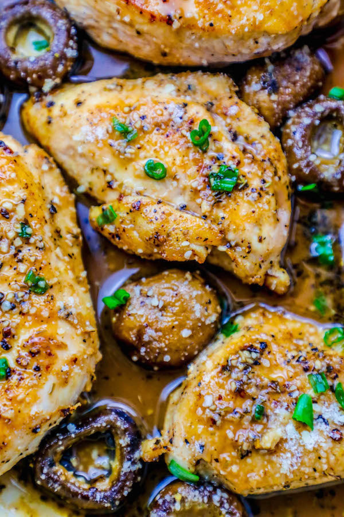 garlic parmesan chicken breasts recipe in a pan with mushrooms picture
