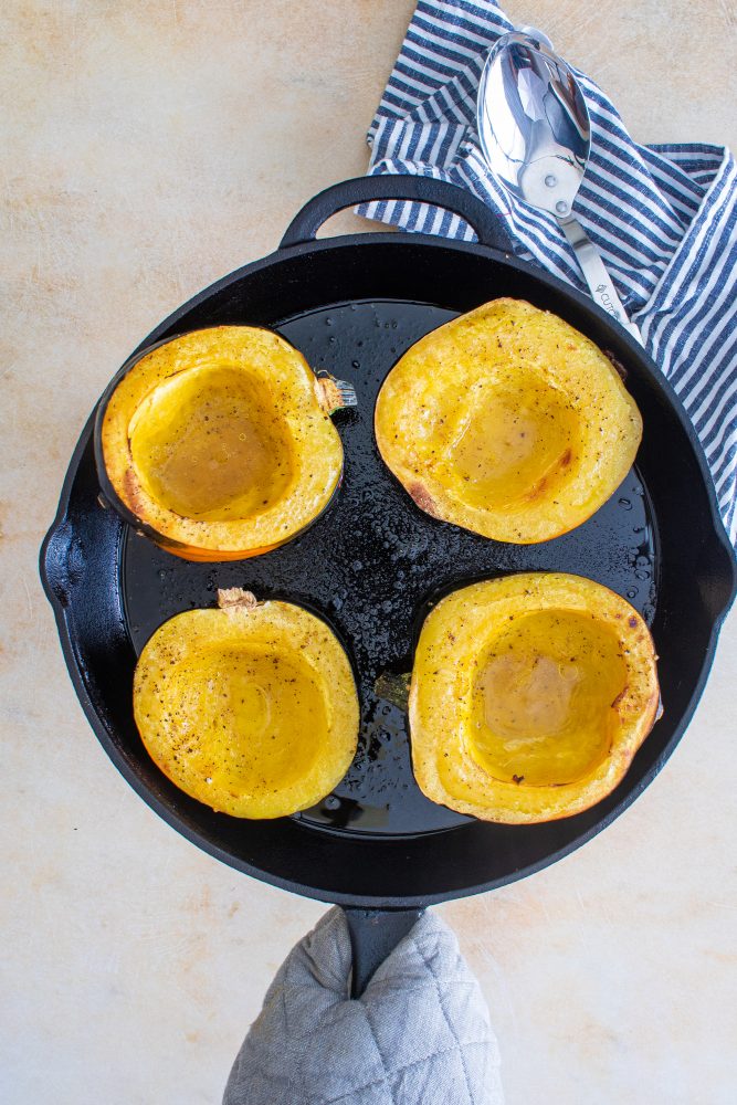 Acorn squash halves, roasted to perfection, showcasing their tender texture.