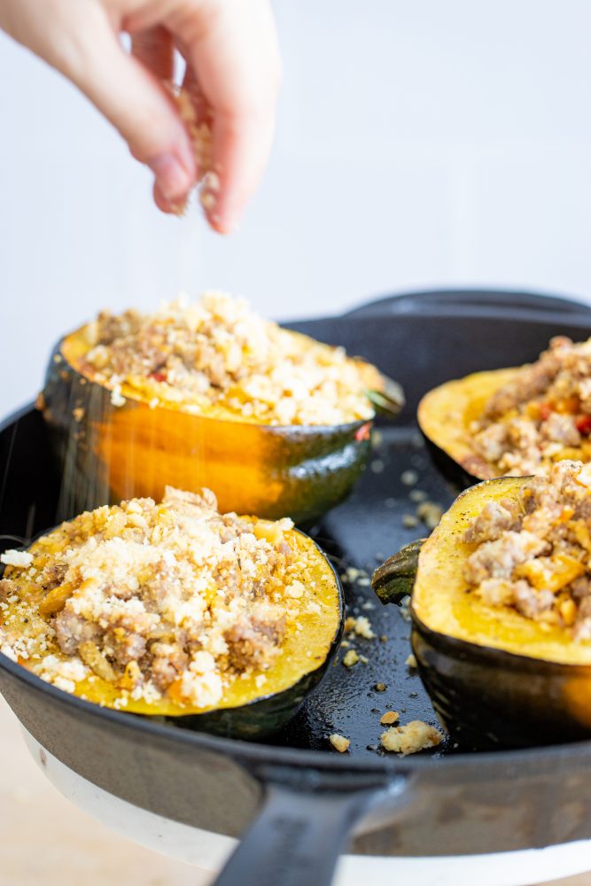 Sausage-stuffed acorn squash skillet, showcasing the completed dish.
