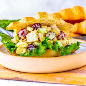 A flavorful chicken salad sandwich on a plate.