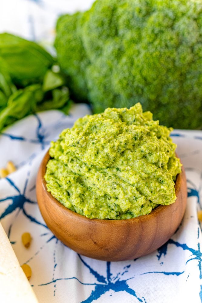 green pesto in a wooden bowl