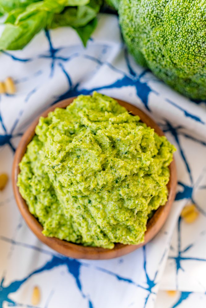 green pesto in a wooden bowl