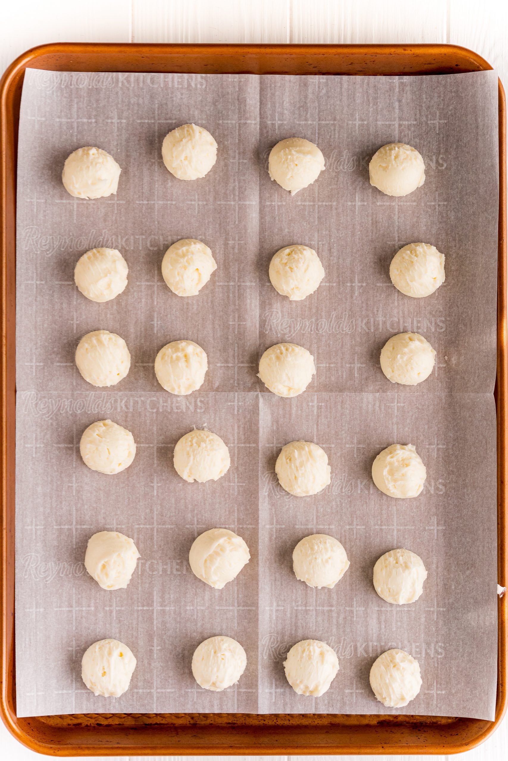 rolled out buttercream candies on a baking sheet