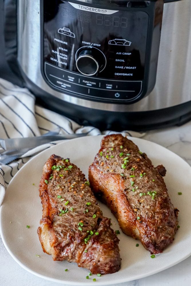 picture of steaks in front of instant pot