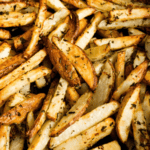 Close-up of lemon garlic seasoned, crispy Air Fryer French fries.