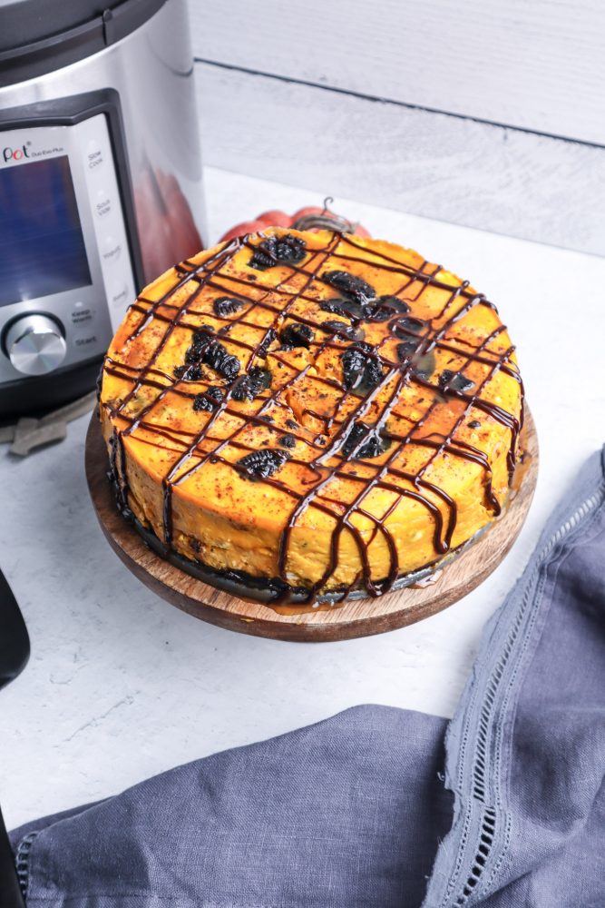  picture of a pumpkin oreo cheesecake next to an instant pot