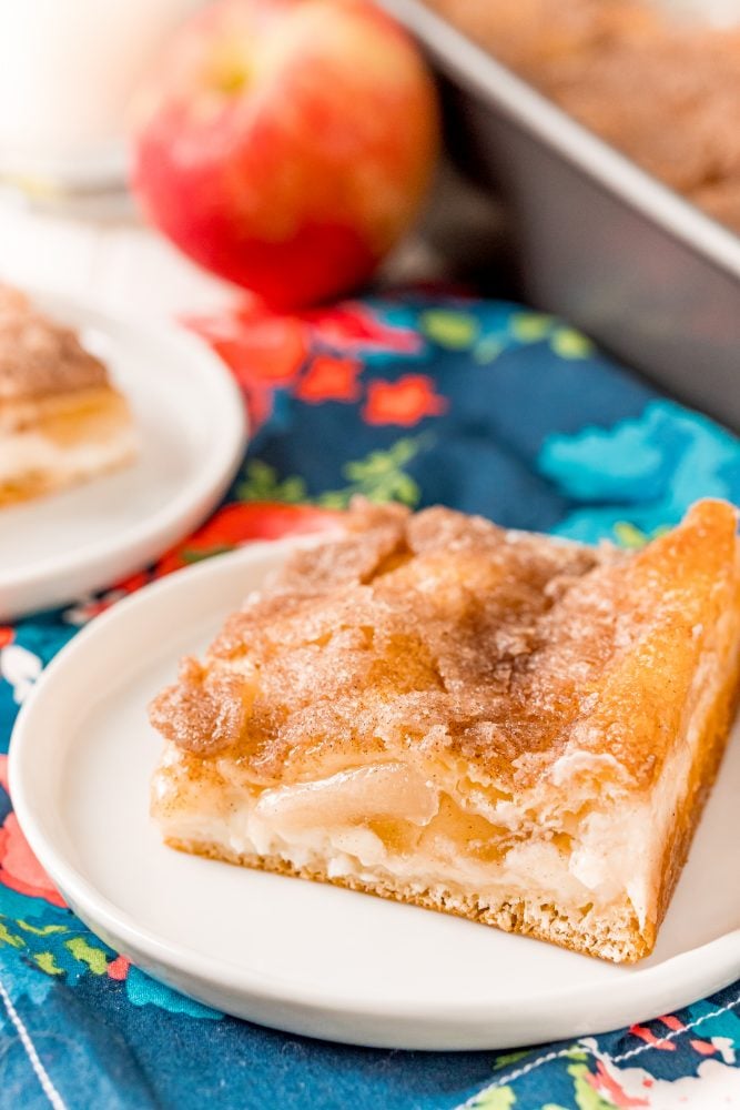 picture of baked apple sopapilla cheesecake on a plate