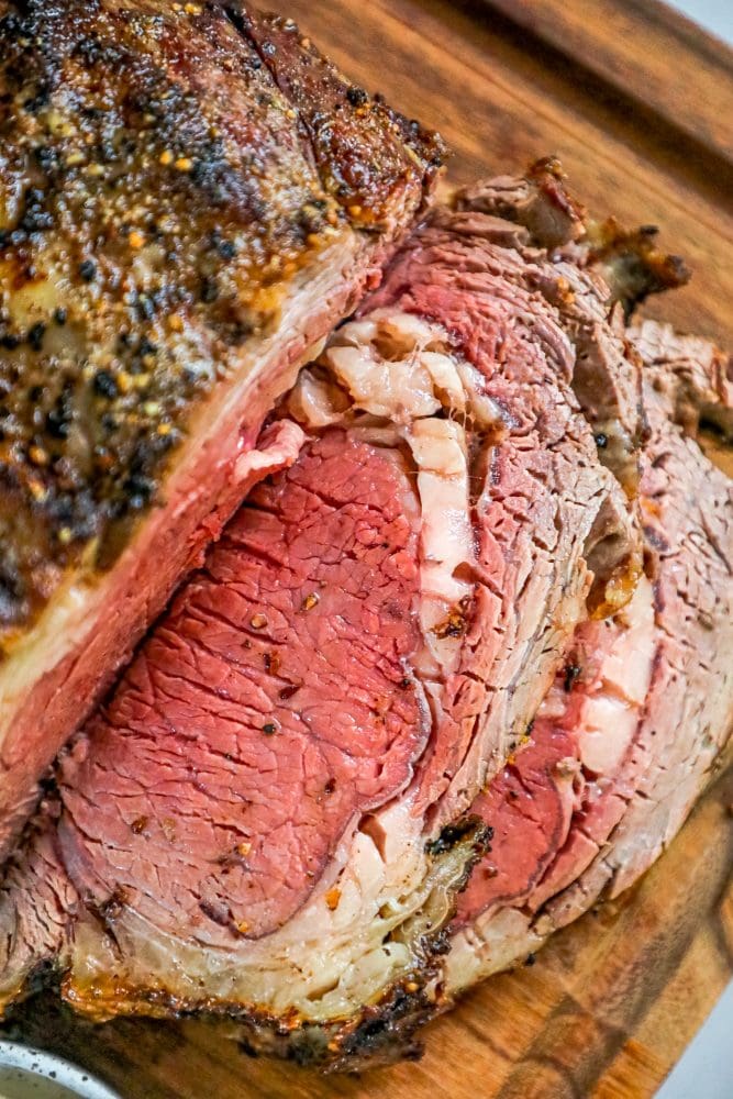 medium rare prime rib on a cutting board