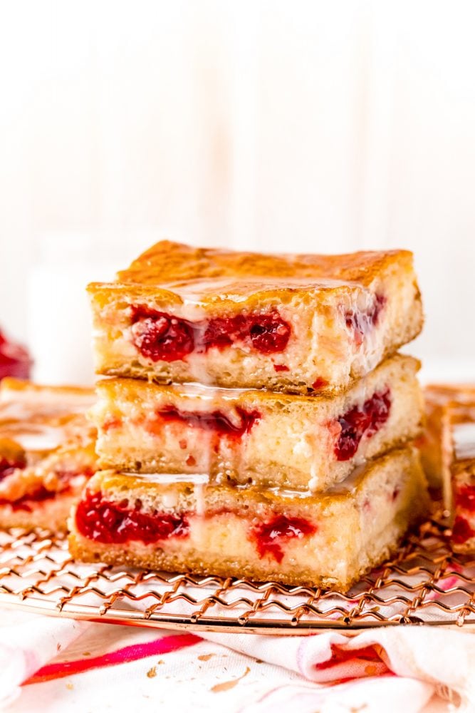 baked cherry cheesecake danish on a white plate