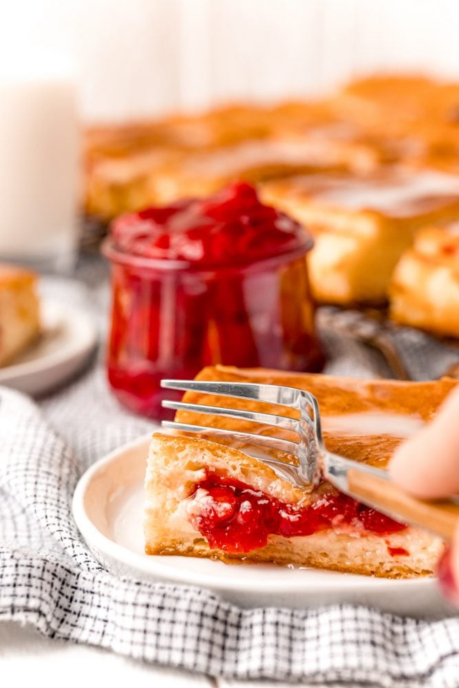 slice of cherry cheesecake danish on a plate on a table