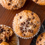 Easy chocolate chip muffins on a wooden cutting board.