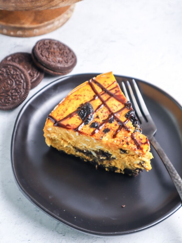 Instant Pot Pumpkin Oreo Cheesecake recipe on a plate with a fork.