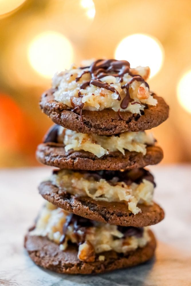 stacked german chocolate iced chocolate cookies on a table