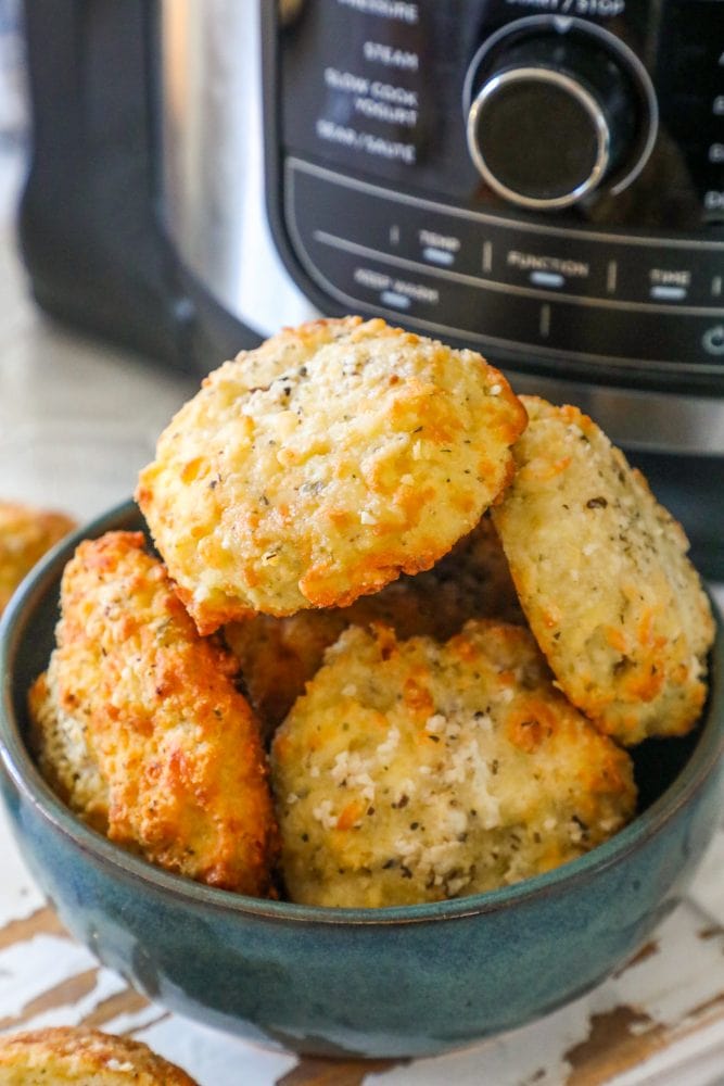 picture of keto rolls in a bowl with air fryer in background