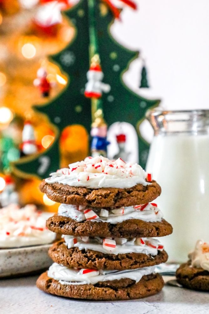 picture of chocolate cookies with frosting and pieces of crushed peppermint candy canes.