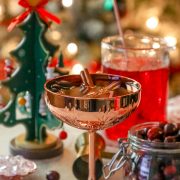 An easy Christmas cocktail featuring cranberries and a festive touch of a Christmas tree.