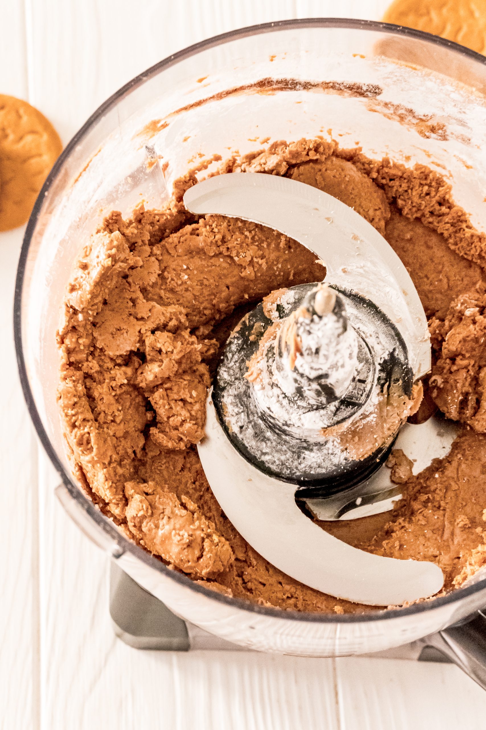 Gingerbread peanut butter cookie dough in a food processor.