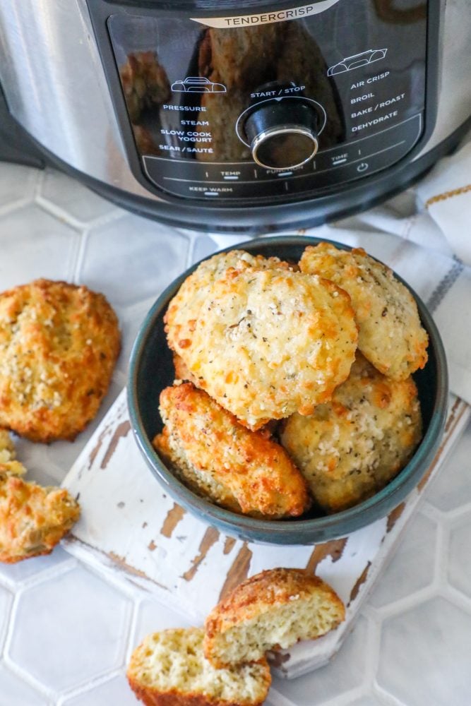 picture of keto rolls in a bowl with air fryer in background