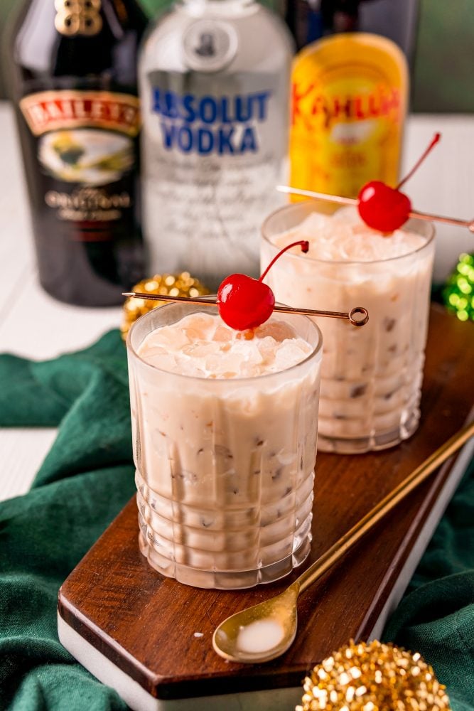 picture of a white russian in a glass with a cherry on a stick