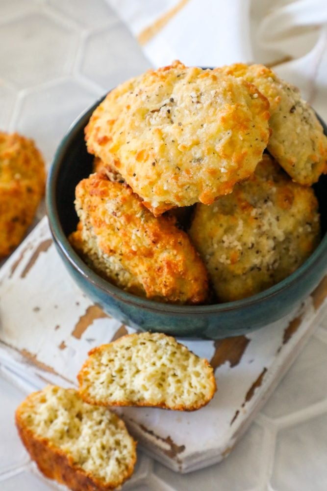 picture of keto rolls in a bowl with air fryer in background