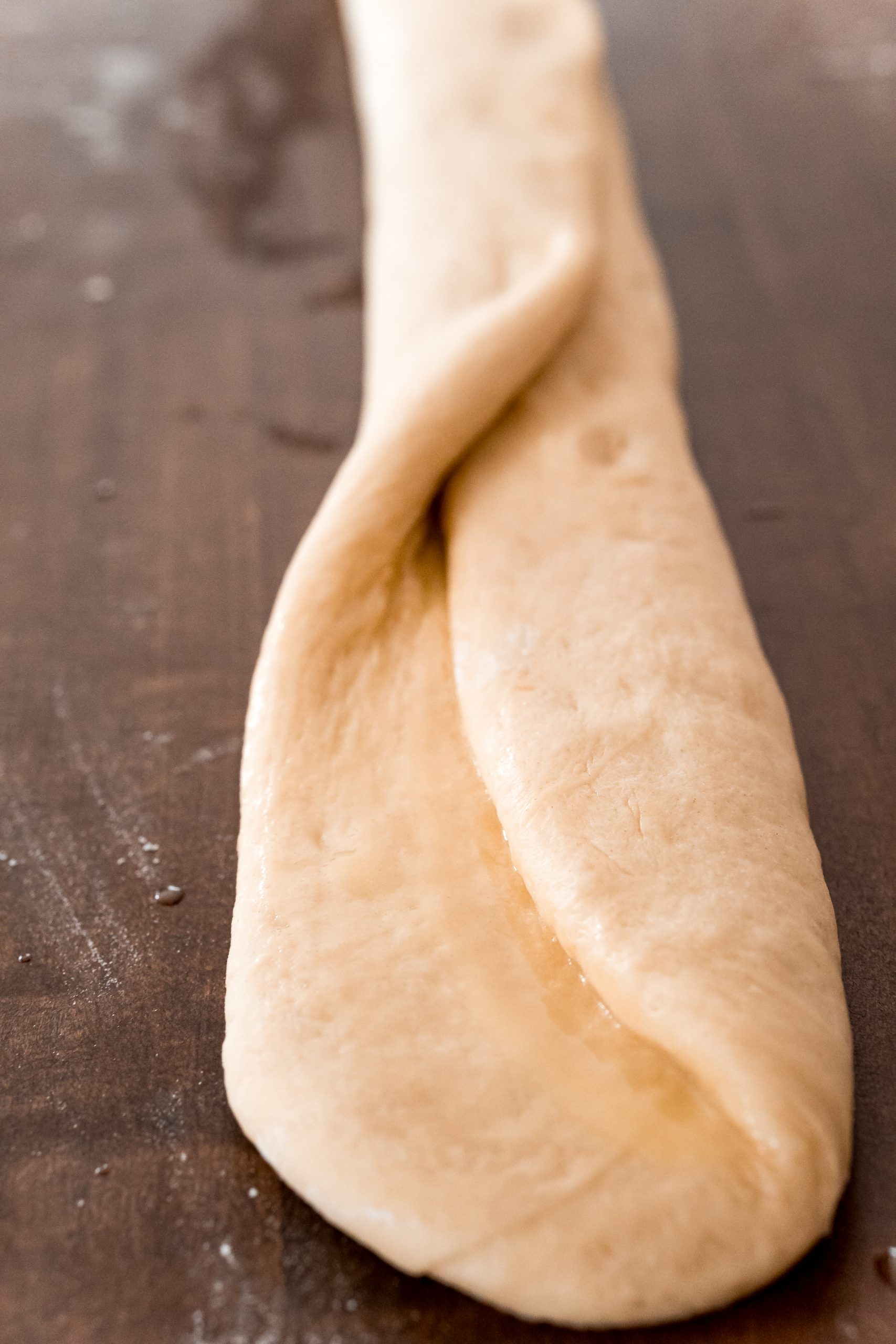 picture of bread roll being folded on table