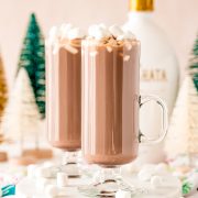Two glasses of hot chocolate with marshmallows on top, made using the RumChata Hot Cocoa Cocktail Recipe.