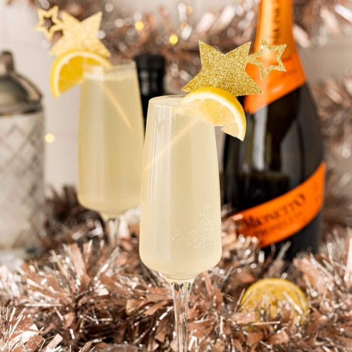 Easy Champagne Cocktail with Lemon Slices and Tinsel.