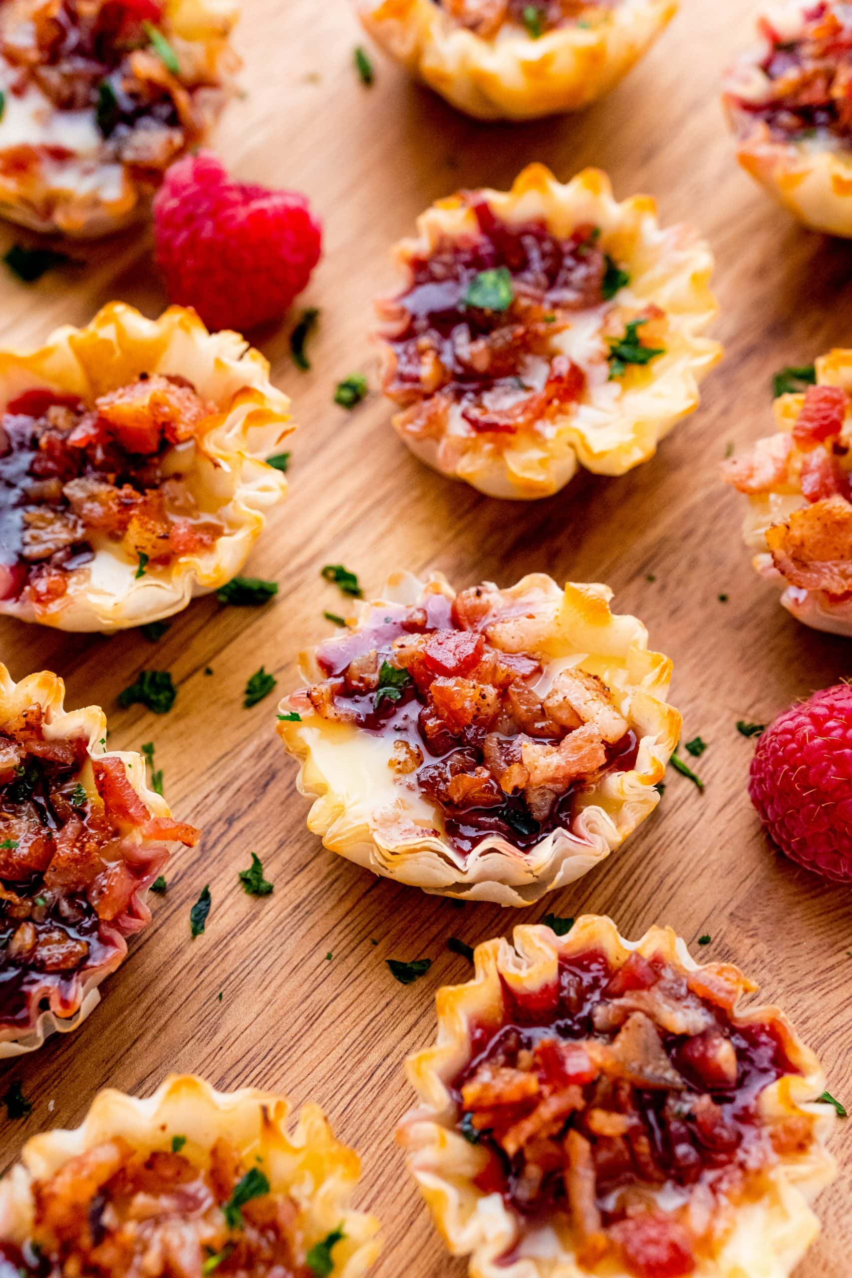 Delicious bacon and cheese bites with raspberry filling, showcased on a platter, ideal for any gathering.