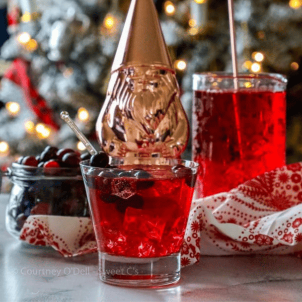 A sparkling cranberry punch with a Santa hat.